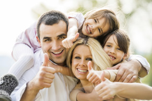 Family showing thumbs up.